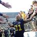 Michigan wide receiver Roy Roundtree celebrates as he high fives fans as he leaves the field after beating Iowa 42-17 at Michigan Stadium. Melanie Maxwell I AnnArbor.com